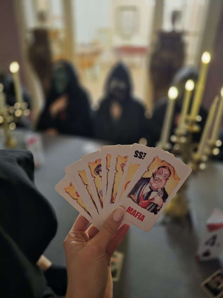 Mafia and parliament-themed card games, friendly atmosphere.