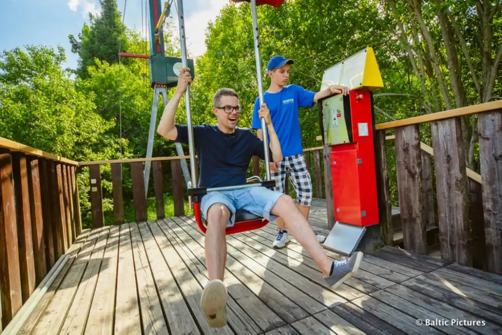 Flying chair with children in the garden, on the playground, fun and entertainment for children.