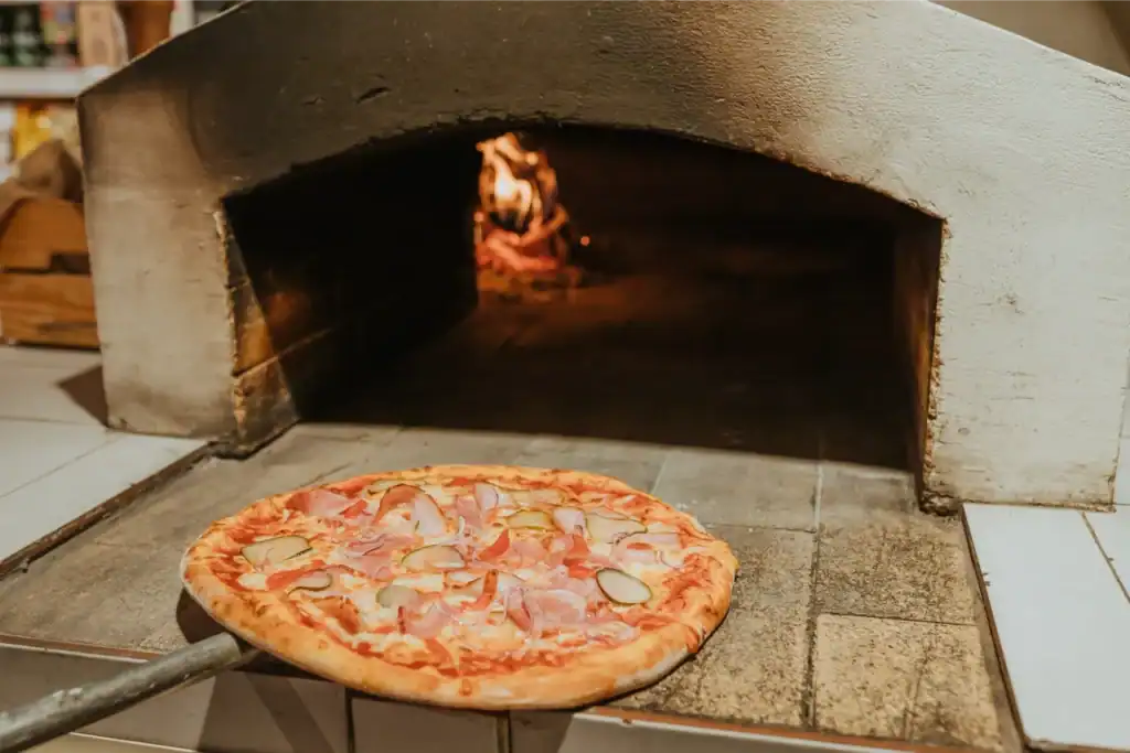 Put the small dough with cheese and meat in the oven, ready to bake.