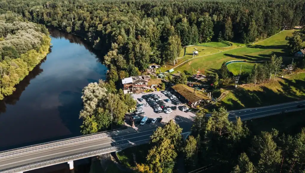 A fascinating natural landscape with lake, forest and road, ideal for relaxing.