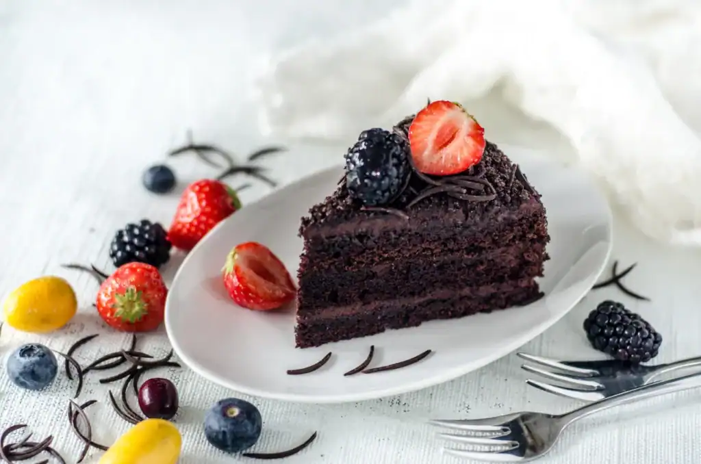 Chocolate cake with berries and fruit, sweet recipe.