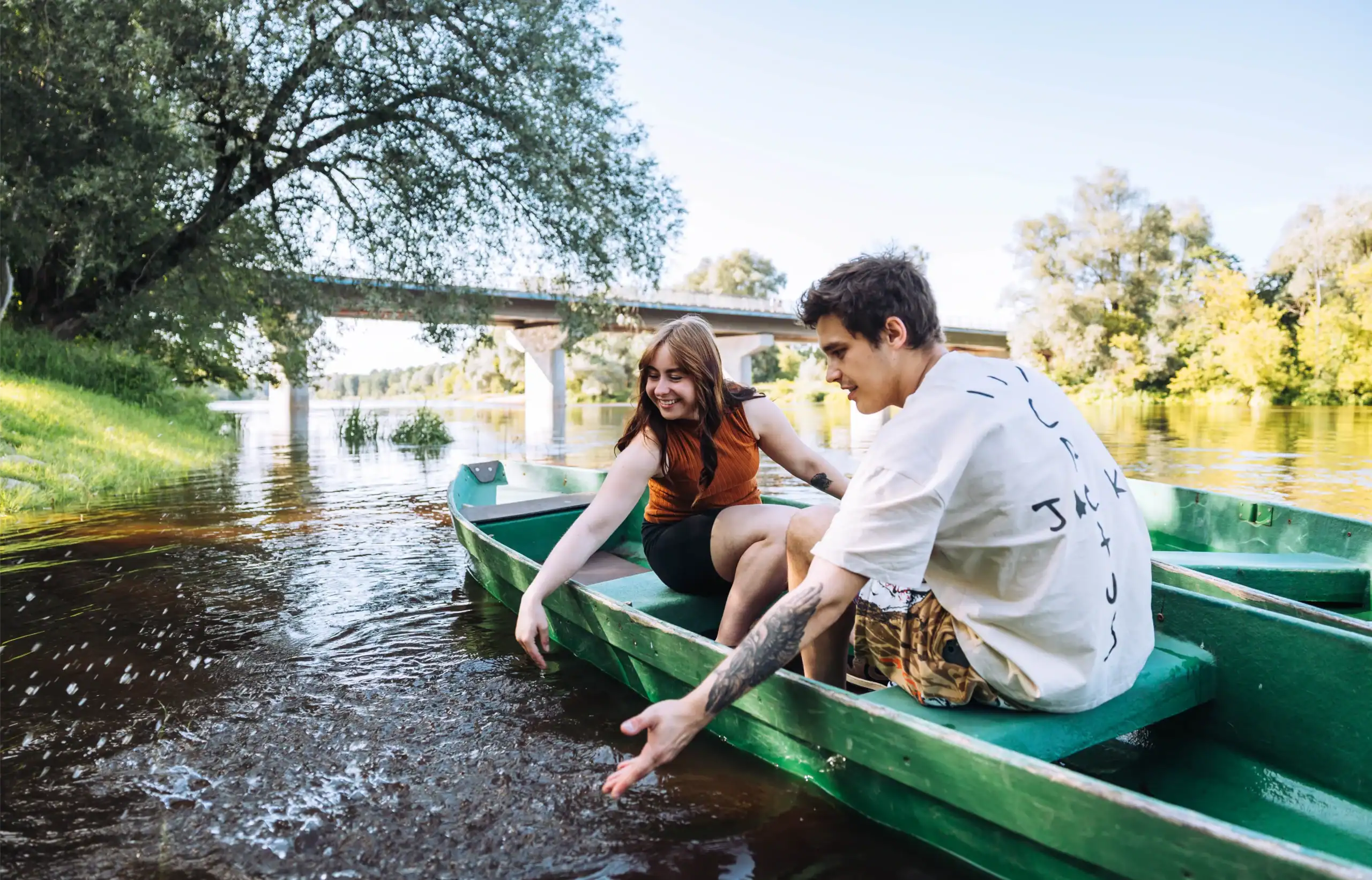 A summer boat trip on the river, active outdoor recreation, a family holiday.