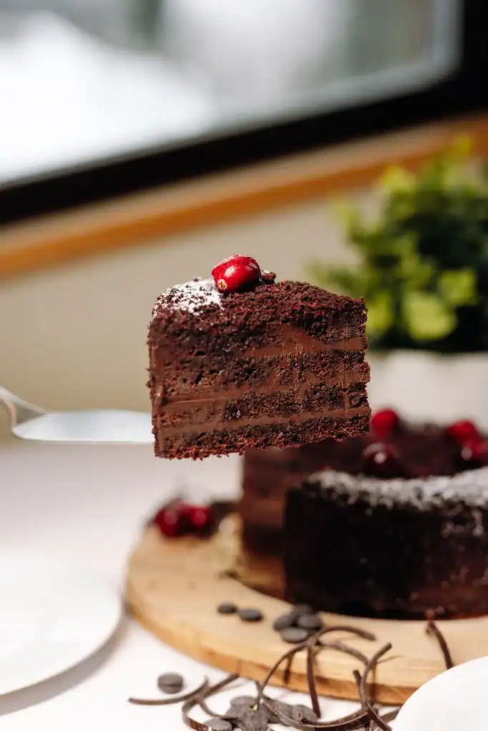 Cakes with chocolate cream, cherries and decorative elements – the perfect choice for dessert.