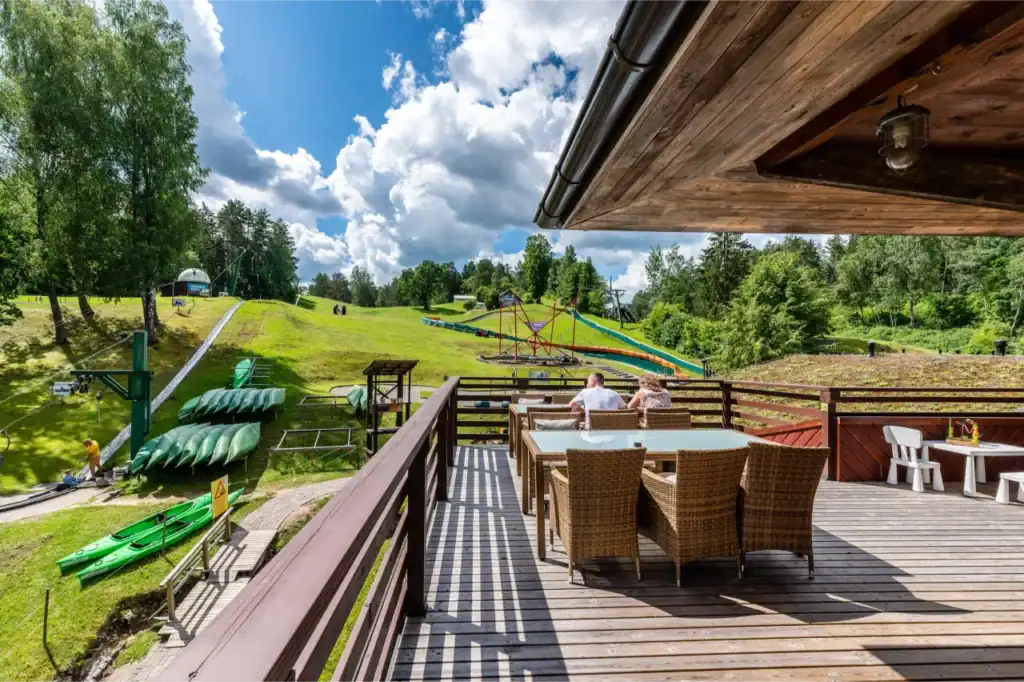 Lounge terrace with mountain views, garden furniture and green surroundings.