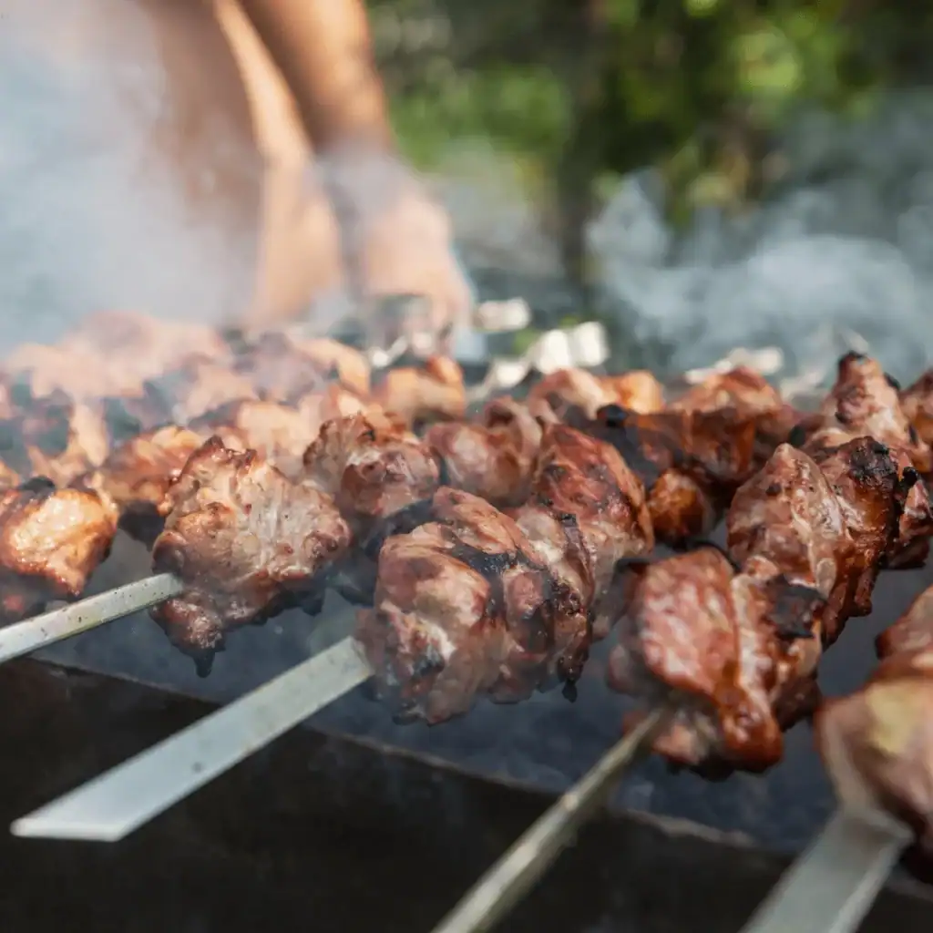 Meat shashlik on coals, summer food, barbecue recipes.