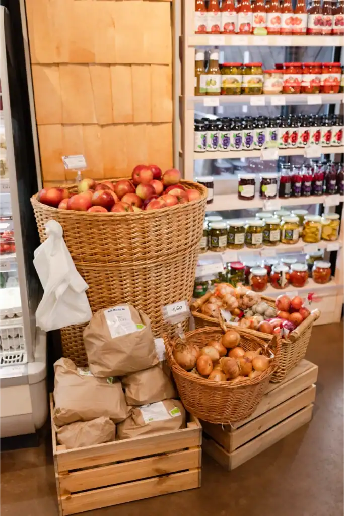 Basket of fresh apples and onions, Ramkalni shop, Latvia.